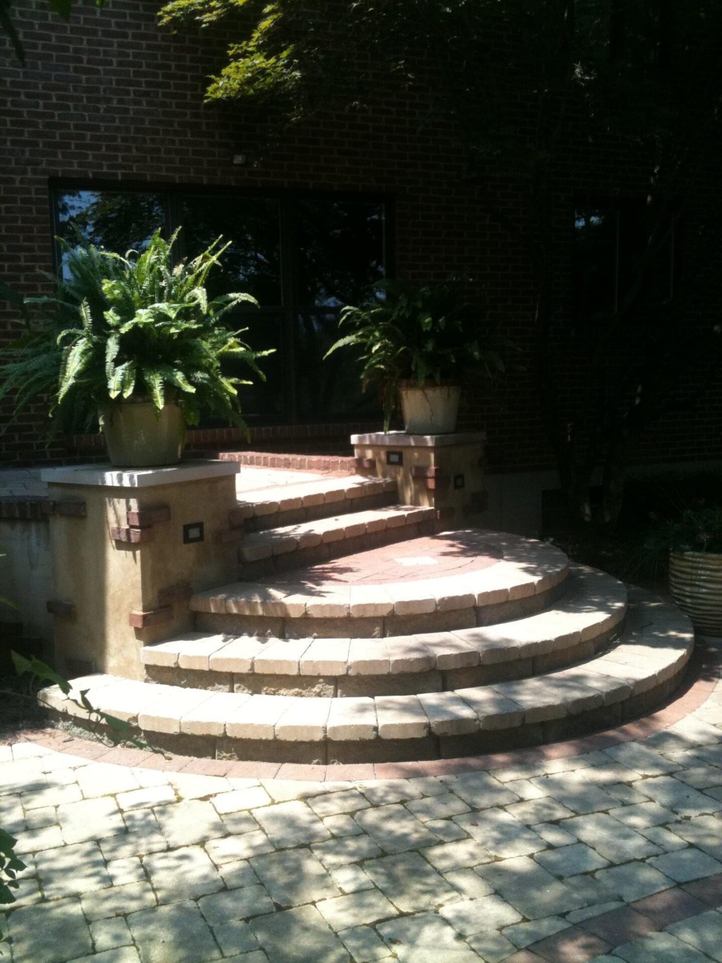 Curved brick steps to house